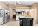Kitchen with island, stainless appliances, granite countertops, and breakfast bar at 5105 Bannock Cir, North Port, FL 34288