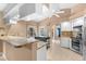 Spacious kitchen featuring granite countertops, stainless steel appliances, and a breakfast bar at 5105 Bannock Cir, North Port, FL 34288