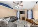 Open and airy living area with plush seating, decorative rug, and large windows at 5105 Bannock Cir, North Port, FL 34288