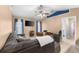 Inviting living room with comfortable sectional sofa, ceiling fan, and stylish decor at 5105 Bannock Cir, North Port, FL 34288