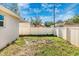 Fenced backyard with some grass and a gate at 5304 Lemon Ave, Seffner, FL 33584