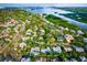 Aerial view showcasing a house's location within a tranquil, waterfront community at 5345 Siesta Ct, Sarasota, FL 34242