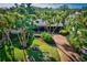 Expansive aerial view showcasing a home's landscaping and driveway at 5345 Siesta Ct, Sarasota, FL 34242