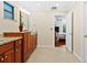 Bright bathroom with double vanity and view into bedroom at 5345 Siesta Ct, Sarasota, FL 34242