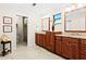Spacious bathroom features double sinks, walk-in shower, and separate toilet area at 5345 Siesta Ct, Sarasota, FL 34242