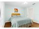 Cozy bedroom with a full bed and hardwood floors at 5345 Siesta Ct, Sarasota, FL 34242