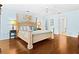 Spacious bedroom with hardwood floors and large windows at 5345 Siesta Ct, Sarasota, FL 34242