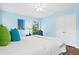 Spacious bedroom with a king bed, hardwood floors, and large closet at 5345 Siesta Ct, Sarasota, FL 34242