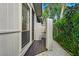 Private outdoor shower with wooden walls and flooring at 5345 Siesta Ct, Sarasota, FL 34242