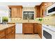 Kitchen boasts granite countertops and updated cabinetry at 5345 Siesta Ct, Sarasota, FL 34242
