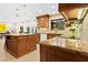 Bright kitchen with granite countertops and large island at 5345 Siesta Ct, Sarasota, FL 34242