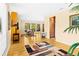 Spacious living room, hardwood floors, and views to dining area at 5345 Siesta Ct, Sarasota, FL 34242