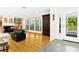 Bright living room with hardwood floors, fireplace and large windows at 5345 Siesta Ct, Sarasota, FL 34242