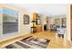 Open living room with hardwood floors and a fireplace at 5345 Siesta Ct, Sarasota, FL 34242