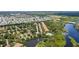 Community with homes and amenities such as a pool, surrounded by greenery and water at 5611 Key West Pl # 5611, Bradenton, FL 34203