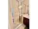 Tiled shower with glass door, chrome fixtures, and built-in shower seat in Primary bath at 5611 Key West Pl # 5611, Bradenton, FL 34203