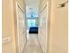 Hallway showing bedroom with ceiling fan at the end at 5611 Key West Pl # 5611, Bradenton, FL 34203