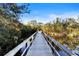 A tranquil wooden bridge surrounded by lush greenery, perfect for nature walks at 5611 Key West Pl # 5611, Bradenton, FL 34203