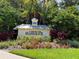 Harborage community entrance sign with lush landscaping at 5611 Key West Pl # 5611, Bradenton, FL 34203