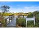 Fishing observation deck with clear signage nestled amongst verdant greenery with waterfront views at 5611 Key West Pl # 5611, Bradenton, FL 34203
