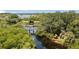 Wooden bridge and kayaks by the water with lush greenery at 5611 Key West Pl # 5611, Bradenton, FL 34203