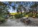 Community recreational area showcasing kayak storage, a picnic table, and natural landscaping at 5611 Key West Pl # 5611, Bradenton, FL 34203