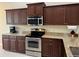 Well-equipped kitchen with stainless steel appliances, granite countertops, and ample cabinetry at 5611 Key West Pl # 5611, Bradenton, FL 34203