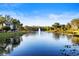 Scenic lakefront view with fountain and lush landscaping at 5611 Key West Pl # 5611, Bradenton, FL 34203