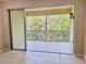 Screened patio showing view of lush landscape at 5611 Key West Pl # 5611, Bradenton, FL 34203