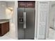 Modern stainless steel refrigerator with built-in water dispenser and cabinet at 5611 Key West Pl # 5611, Bradenton, FL 34203