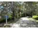 Shaded walking path winds through trees and foliage towards amenities at 5611 Key West Pl # 5611, Bradenton, FL 34203