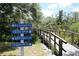 Community sign shows direction and distance to Anna Maria Island, Key West, Gulf of Mexico, and Everglades at 5611 Key West Pl # 5611, Bradenton, FL 34203
