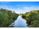 Scenic water view with lush greenery on either side creates a tranquil natural setting at 5611 Key West Pl # 5611, Bradenton, FL 34203