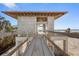 Partially completed home showcasing its sturdy block framework and prime beachside location under a clear sky at 5965 Gulf Of Mexico Dr, Longboat Key, FL 34228