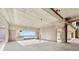 Unfinished interior featuring ocean views framed by concrete walls and large windows, awaiting customization at 5965 Gulf Of Mexico Dr, Longboat Key, FL 34228
