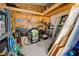 Shed interior with wooden shelves, storage containers, tools, and ladders at 6824 Haawi Ct, North Port, FL 34287