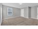 Additional bedroom with neutral-toned carpet and walls, ample space, and large window at 7005 57Th E Ter, Palmetto, FL 34221