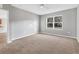Bedroom with plush carpet, gray walls, large window, and view to the outdoors at 7005 57Th E Ter, Palmetto, FL 34221