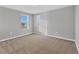 Empty bedroom with gray walls, plush carpet, and window with blinds at 7005 57Th E Ter, Palmetto, FL 34221