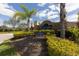 Crystal Lakes community entrance sign with lush landscaping and palm trees at 7005 57Th E Ter, Palmetto, FL 34221