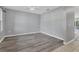 Dining area with gray walls, white trim, and wood-look flooring adjacent to the kitchen at 7005 57Th E Ter, Palmetto, FL 34221