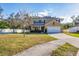 Two-story home with a fenced yard, driveway, and attached garage at 7005 57Th E Ter, Palmetto, FL 34221