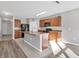 Kitchen with island, wood cabinets, and stainless steel appliances at 7005 57Th E Ter, Palmetto, FL 34221