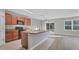 Kitchen with wood cabinets, black appliances, and sliding glass door at 7005 57Th E Ter, Palmetto, FL 34221