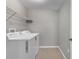 Laundry room with washer, dryer, and overhead shelving at 7005 57Th E Ter, Palmetto, FL 34221