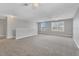Spacious bonus room with gray walls, plush carpet, and multiple windows at 7005 57Th E Ter, Palmetto, FL 34221