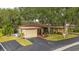 View of the home's exterior, featuring an attached garage and manicured lawn at 7030 Bright Creek Dr # 51, Sarasota, FL 34231