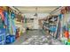 Organized garage with storage shelves, tools, and bicycles at 7030 Bright Creek Dr # 51, Sarasota, FL 34231