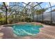 Relaxing screened pool and spa area with ample space for lounging at 7651 Portstewart Dr, Lakewood Ranch, FL 34202