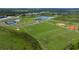 Community overview with sports fields and lake at 8020 Moonbeam Ave, Sarasota, FL 34241